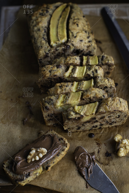 Choco chips and walnut banana bread sliced and spread with chocolate