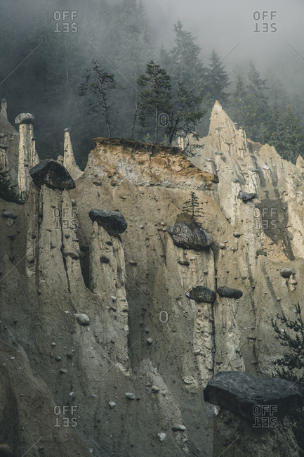 Earth pyramids in the mist, South Tyrol, Italy