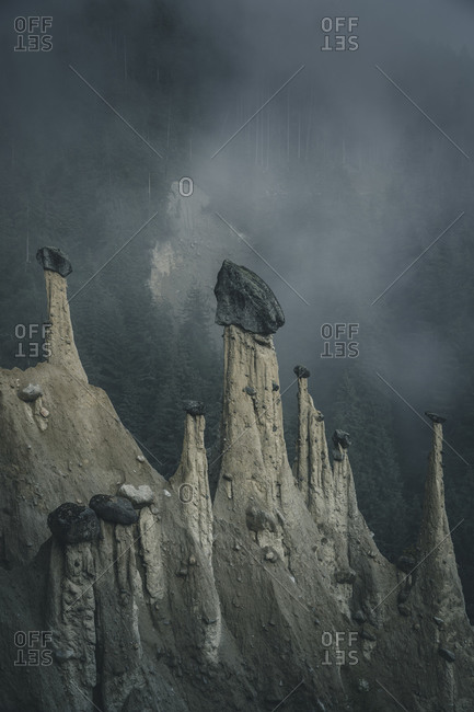 Earth pyramids in the mist, South Tyrol, Italy