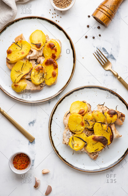 Roasted chicken fillet with baked sliced potato with rosemary
