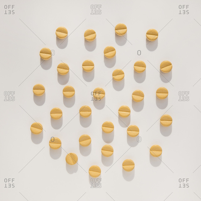 Studio shot of bunch of yellow pills