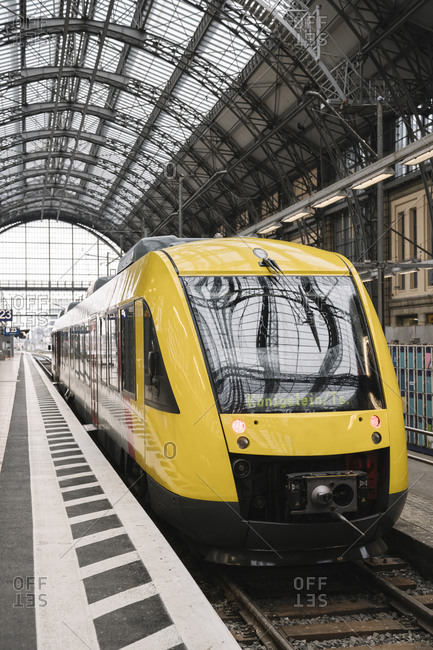 March 6, 2020: Germany- Hesse- Frankfurt- Yellow train waiting at train station