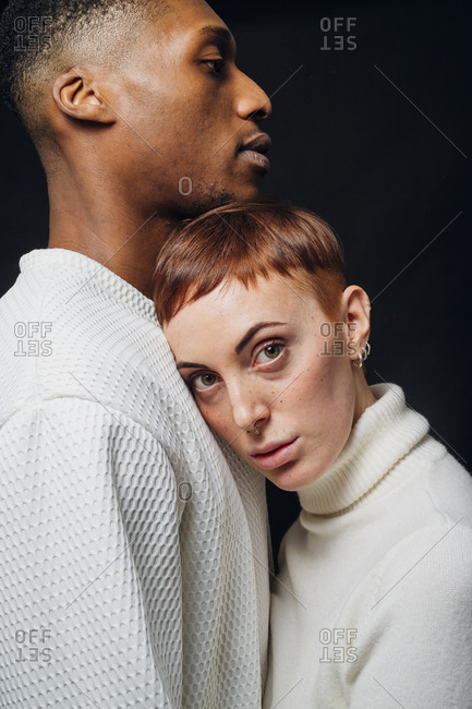 Studio portrait of affectionate mixed race couple
