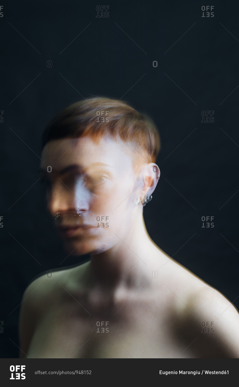 Double exposure portrait of nude young woman in studio