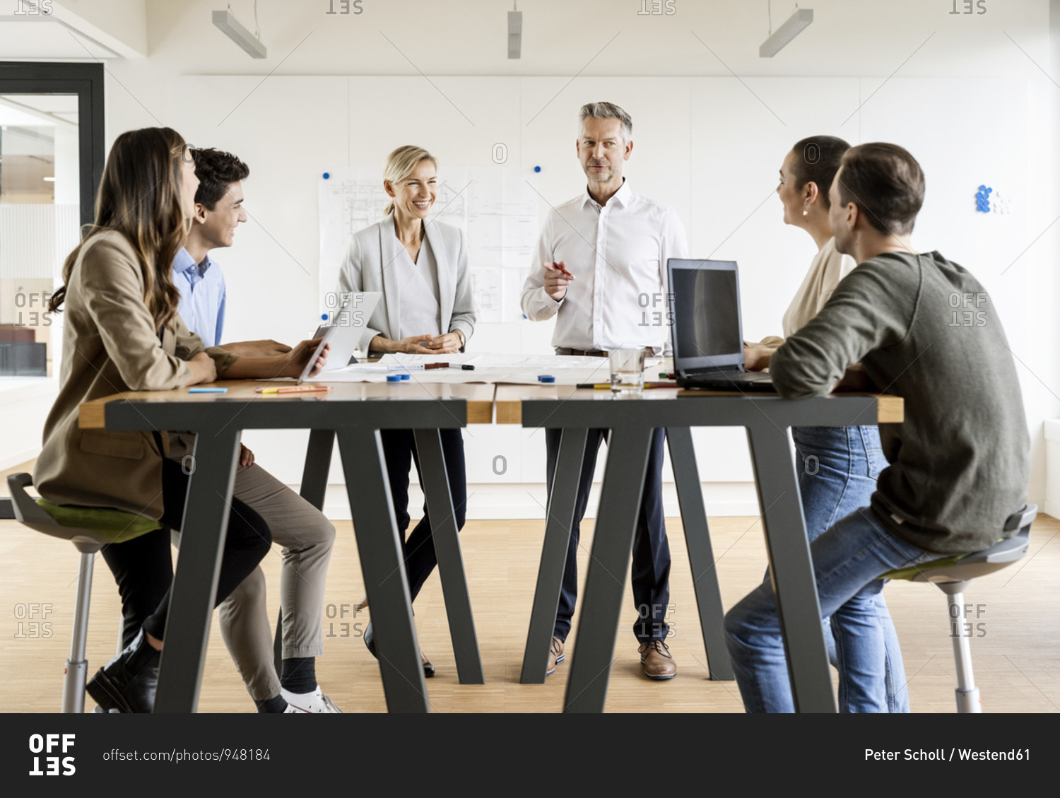 Businesswoman and businessman leading a meeting in office