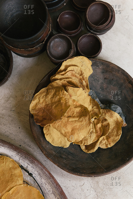 Stacks of freshly cooked tortillas wait for service at a restaurant
