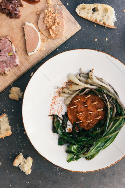 Gourmet ramp sauce and meat and cheese platter on table top