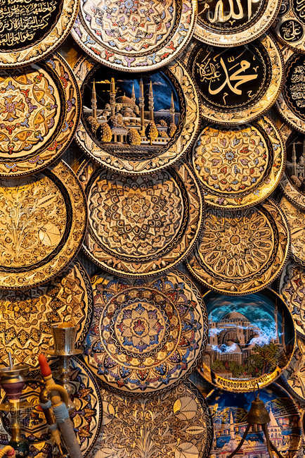 February 20, 2018: Decorative plates with drawings of Istanbul landmarks at a market stall. Istanbul, Turkey