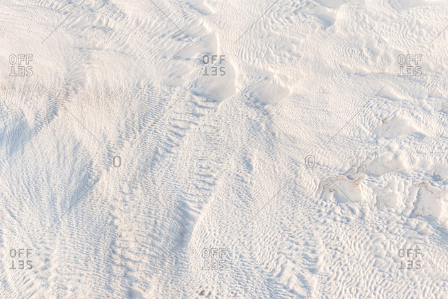 Abstract white limestone textured background in sunny day, Pamukkale, Turkey