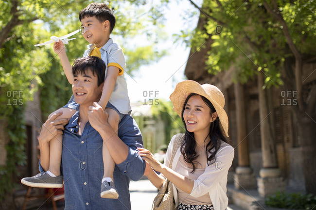 Young Chinese family enjoying vacation