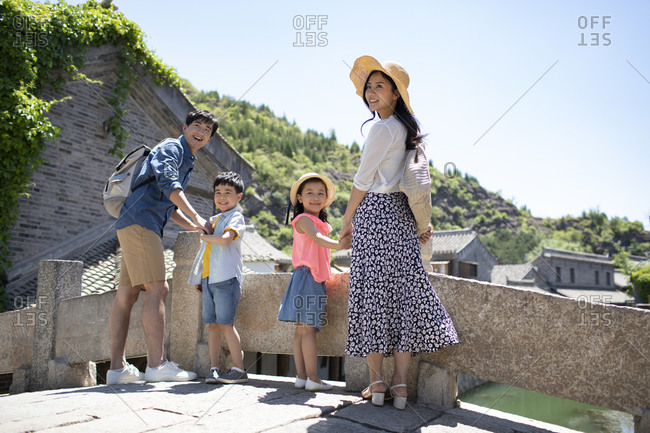 Young Chinese family enjoying vacation
