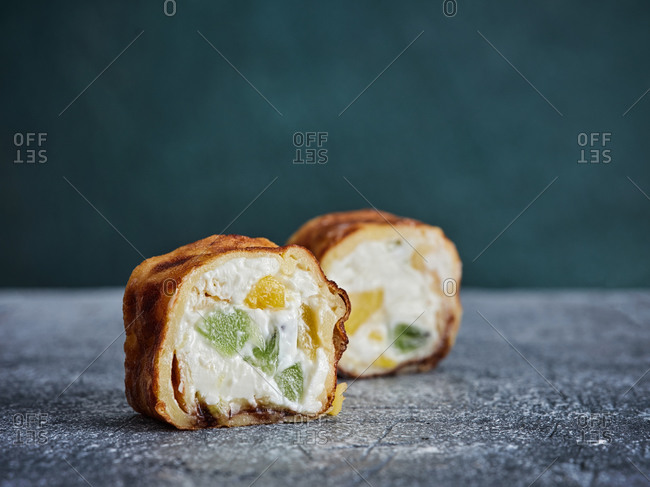 Sweet sushi rolls wrapped in rice crepes and filled with sweet cream cheese and fruits