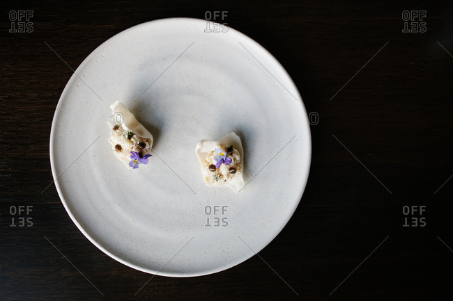 A gourmet dessert with edible flowers