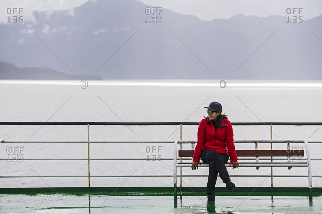 Woman relaxing on a passenger vessel traveling in South America