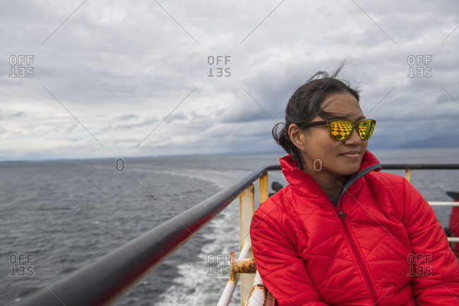 Woman relaxing on a passenger vessel traveling in South America