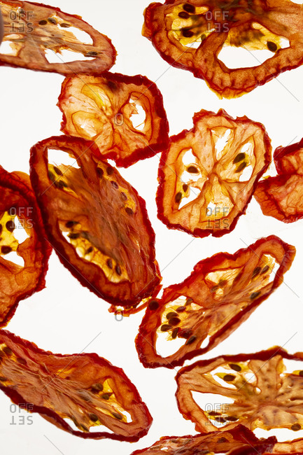 Dried tomato slices on a white background