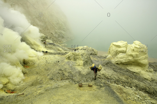 Indonesia- Java- Sulphur miners working in the crater at Kawah Ijen