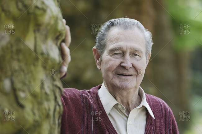 Germany- Cologne- Portrait of senior man in park- close up