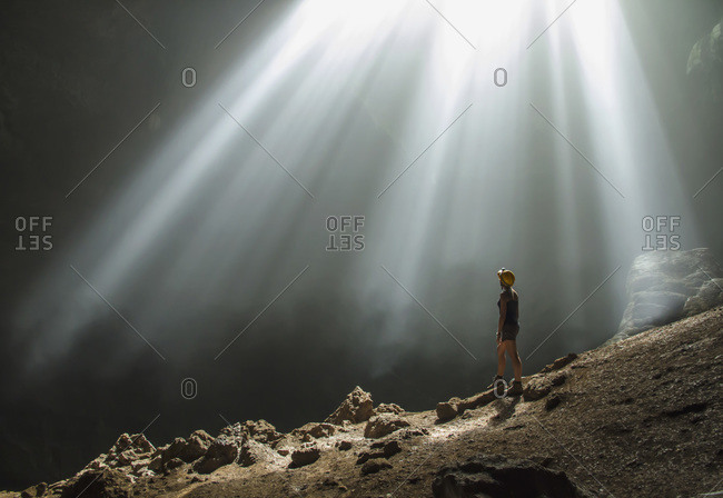 Indonesia- Young woman looking at sunbeam