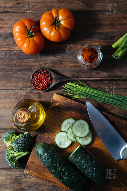 Variety of fresh healthy food consisting of tasty fresh vegetables berries and herbs on wooden rustic table