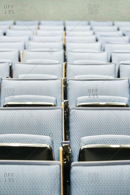 Rows of comfortable seats located inside empty lecture hall before lesson in contemporary university