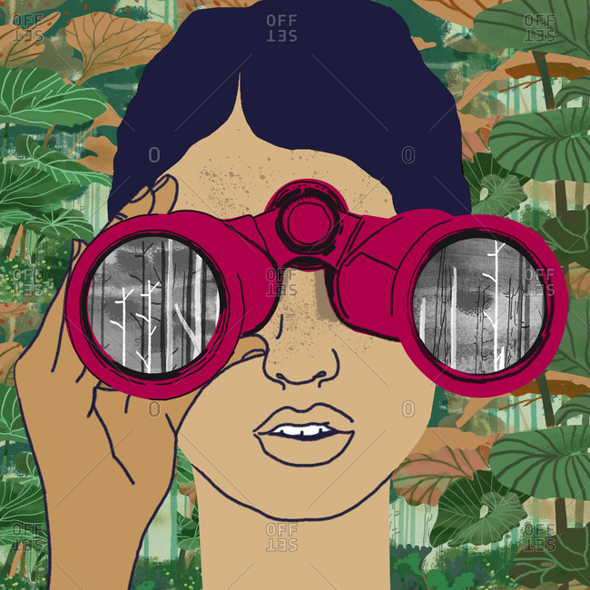 Woman with binoculars looks at deforestation