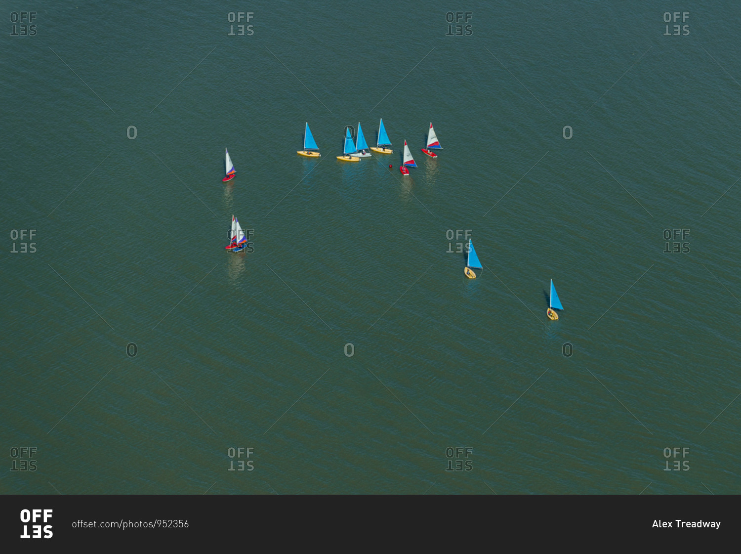 An aerial view of sailing dinghies competing in a race on the Thames