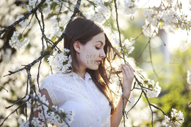 Portrait of a young woman with cherry blossoms