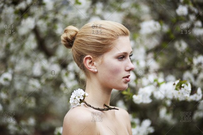 Portrait of a young woman with cherry blossoms