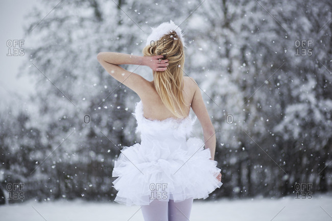 Ballerina standing outside on a snowy day
