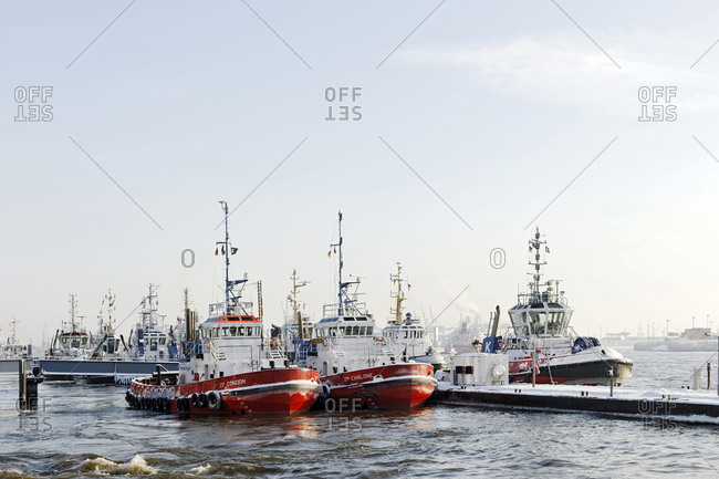 December 18, 2010: Towboats docked alongside the River Elbe, Oevelgoenne, Neumuehlen, Hanseatic City of Hamburg, Germany