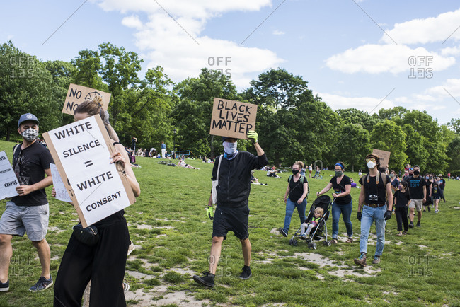 New York City, New York, USA - May 31, 2020: Peaceful protest demanding justice for the death of George Floyd, through Prospect Park, organized by Park Slope families, Brooklyn , New York City, USA.