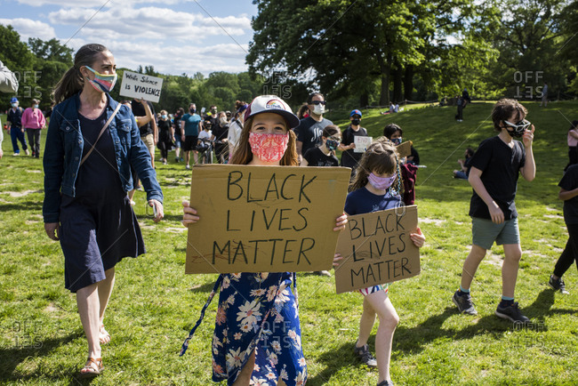 New York City, New York, USA - May 31, 2020: Peaceful protest demanding justice for the death of George Floyd, through Prospect Park, organized by Park Slope families, Brooklyn , New York City, USA.