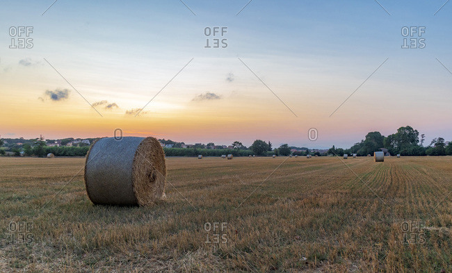 Rural village with straw bales at sunset on the Mediterranean coast