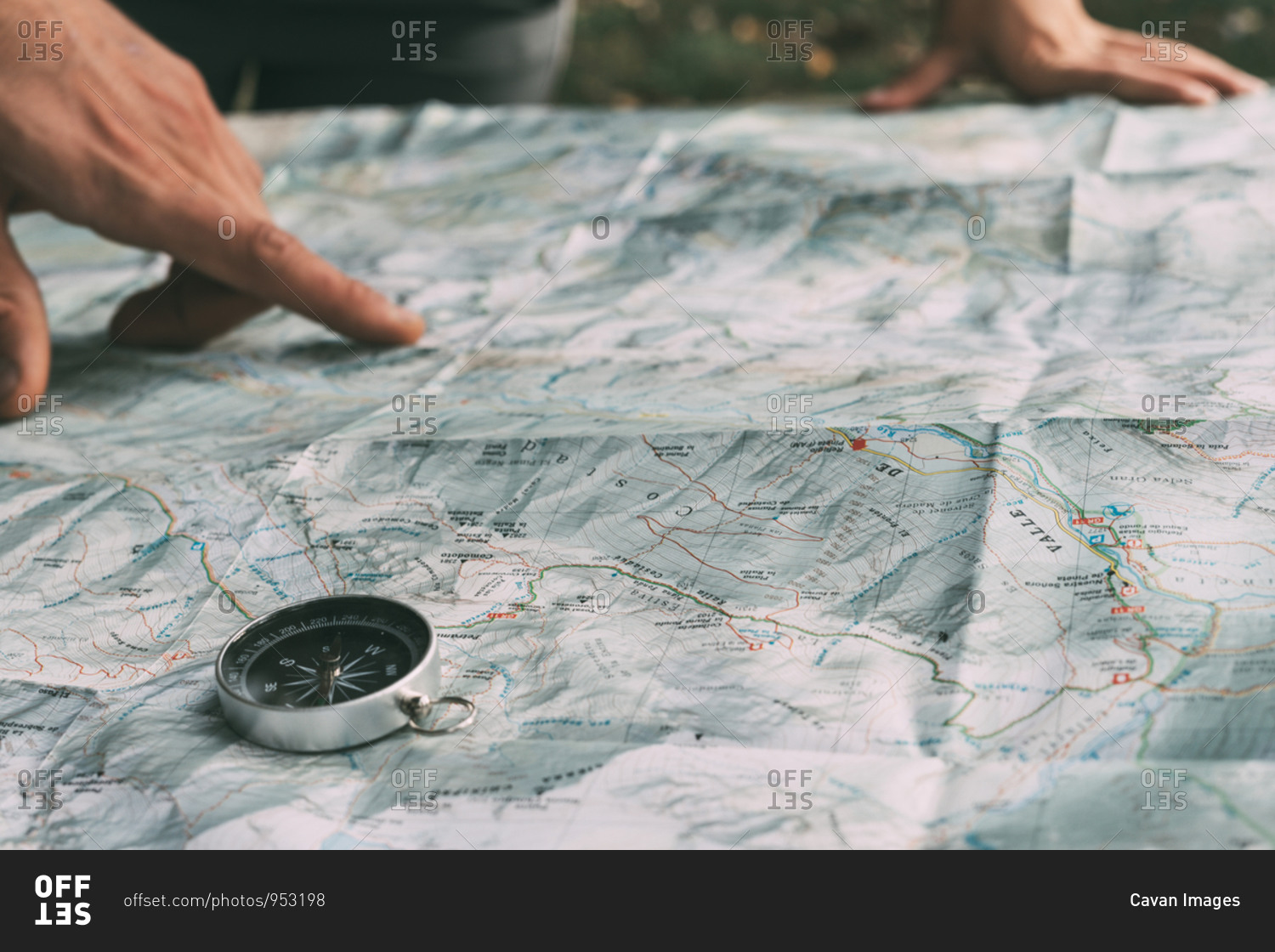Planning the route on a map and a compass