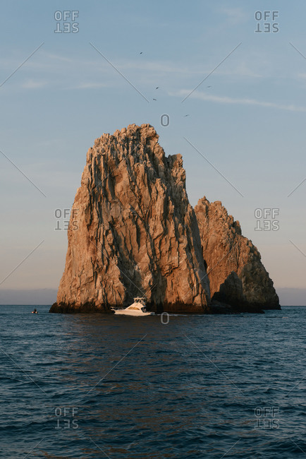 Fishing boat crossing the last rock of the Arch of Cabo San Lucas
