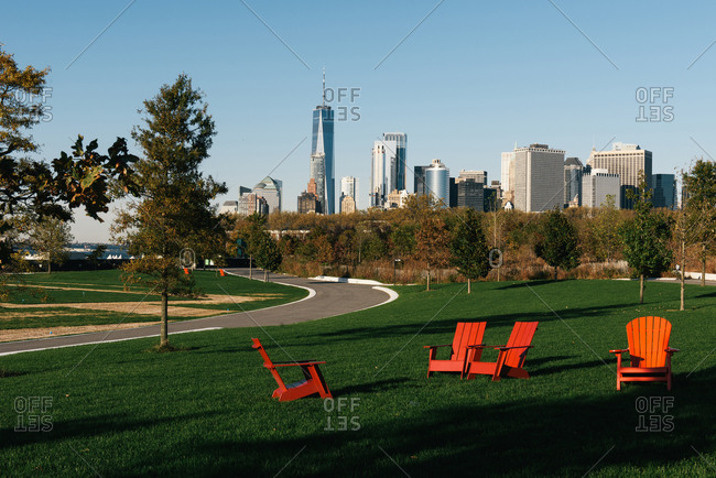 Chaise lounge chairs on the green lawn at Governors Island in NYC