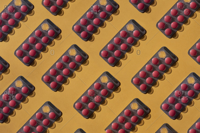 Pattern of red pills blister packs