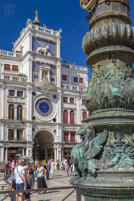 September 12, 2019: View of Torre dell'Orologio and ornate lamp post in St. Mark's Square, Venice, UNESCO World Heritage Site, Veneto, Italy, Europe