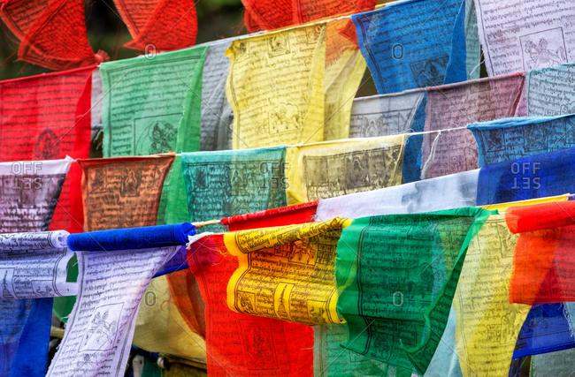 October 23, 2019: Buddhist Prayer flags carrying worshippers wishes sway in the wind, Bhutan, Asia