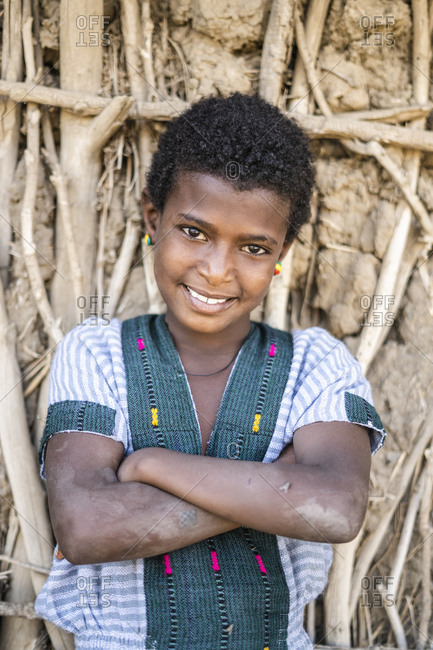 January 31, 2020: Portrait of girl with crossed arms smiling at camera, Abala, Afar Region, Ethiopia, Africa