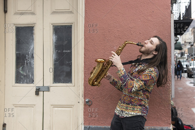 February 6, 2020: Saxophone player on a Bourbon Street corner in the French Quarter of New Orleans, Louisiana, United States of America, North America
