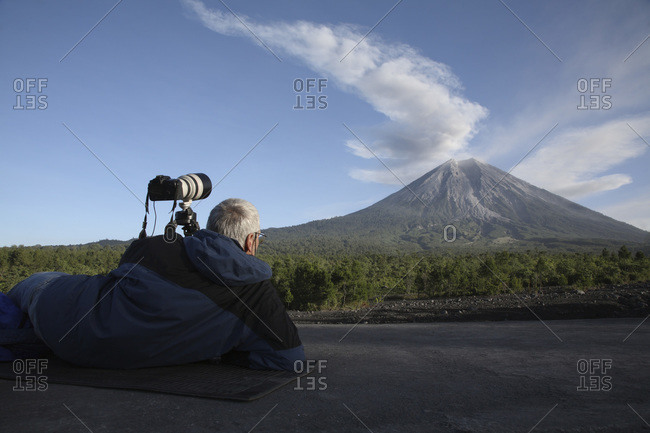 Indonesia- East Java- Semeru volcano- Ash eruption- Man in foreground