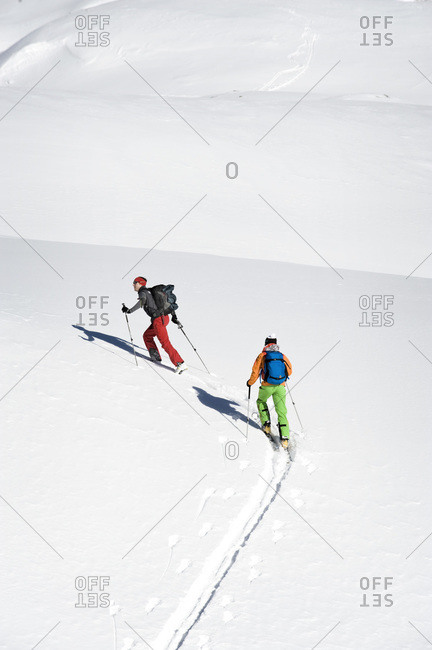Austria- Men skiing on mountain at Salzburger Land