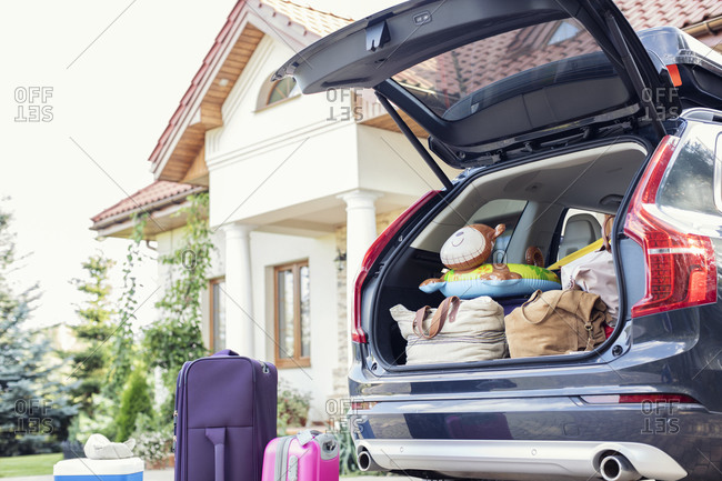 Open car boot packed for family vacation