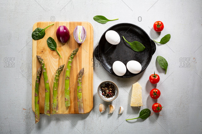 Overhead view of fresh asparagus frittata ingredients