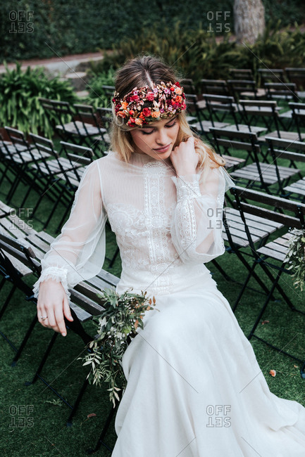 Elegant bride resting on guest seats