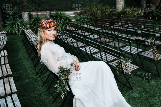 Elegant bride resting on guest seats