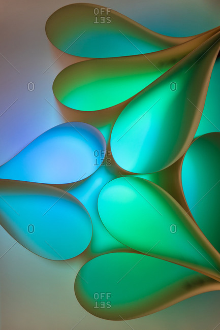 Abstract multicolored green and blue background with glowing bubbles of different shapes and colors