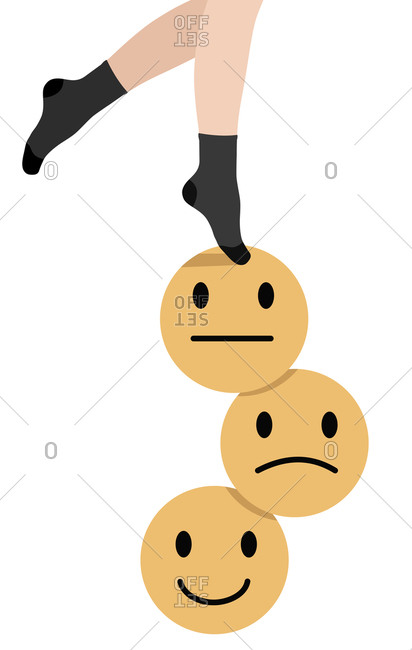 Close up of girl's feet trying to balance on top of three emoticons